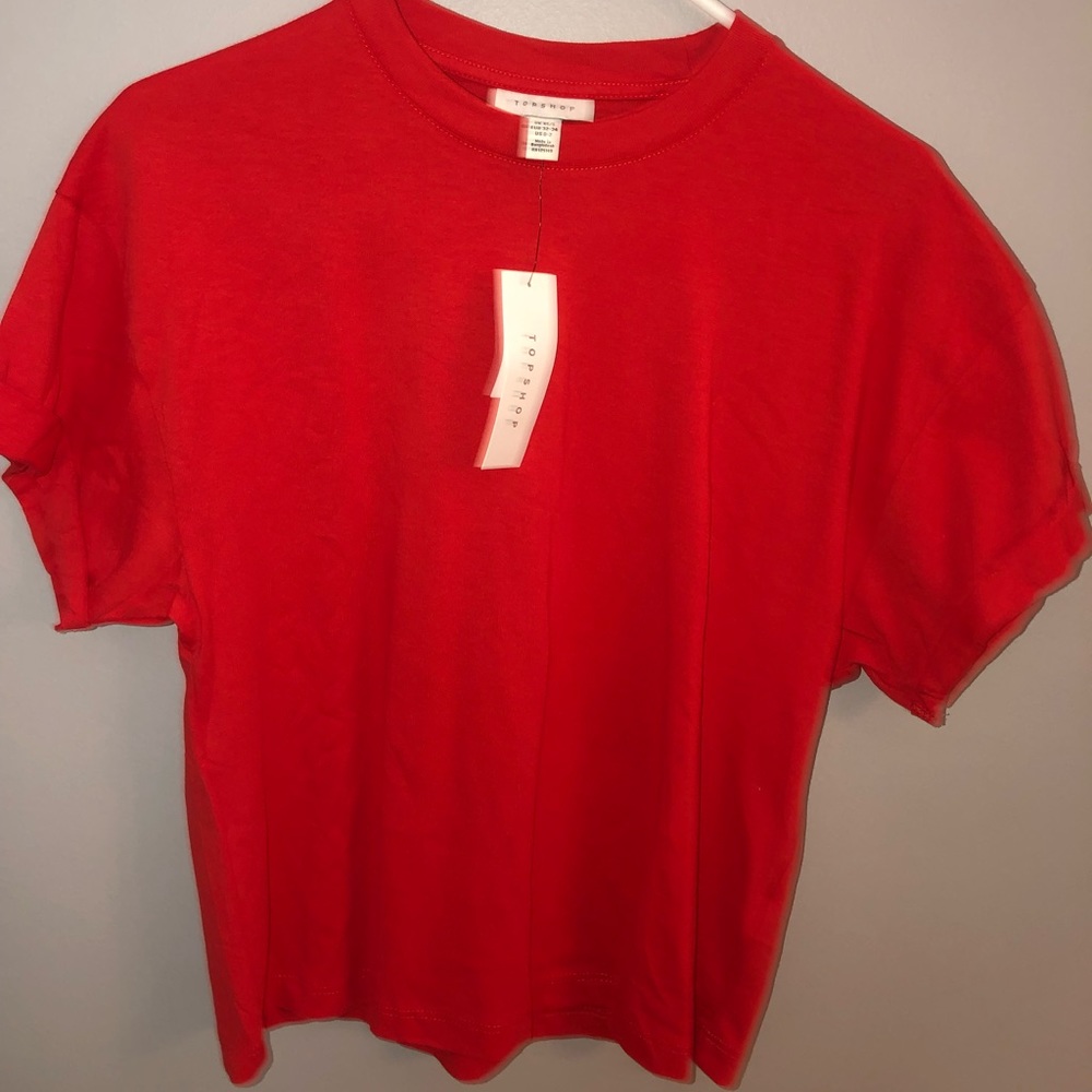 Red short sleeve shirt.